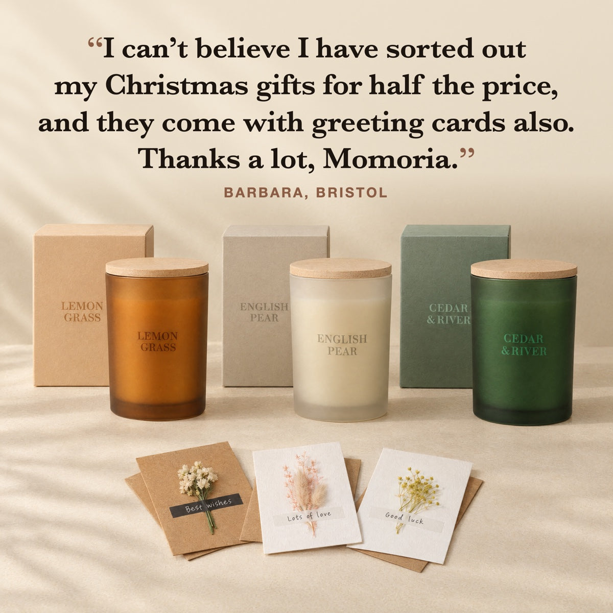 The three candles with their gift boxes and three greeting cards, with a customer quote from Barbara in Bristol